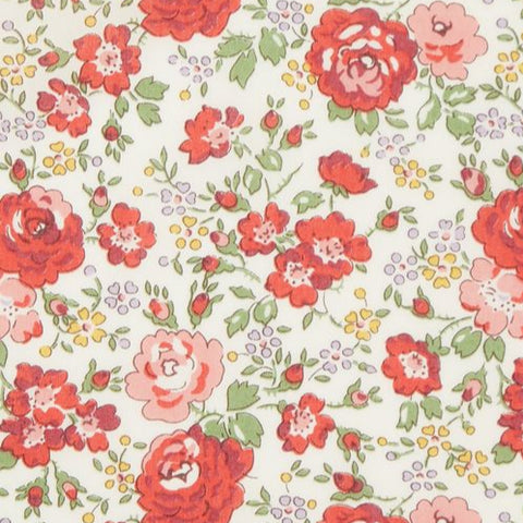 Floral patterned fabric with a ruler for scale on a white background