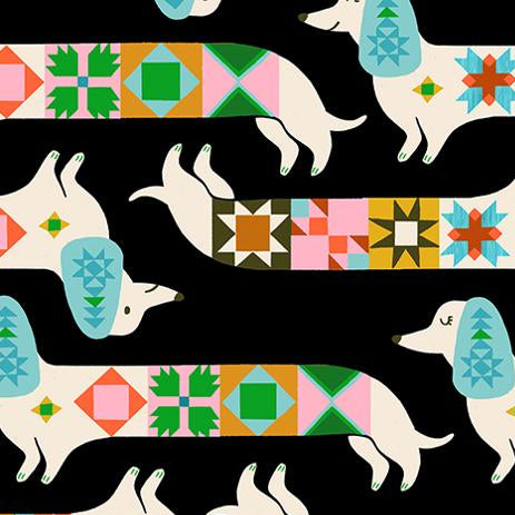 Patterned fabric with dogs and colorful geometric shapes on a black background