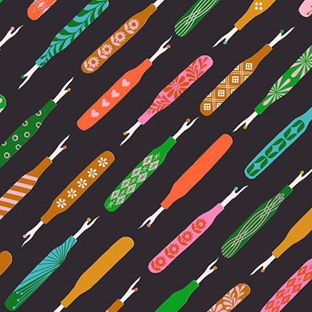 Colorful pattern of fabric swatches with a ruler at the bottom on a black background