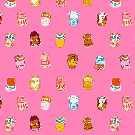 Patterned fabric with cartoon-style thimbles on a pink background