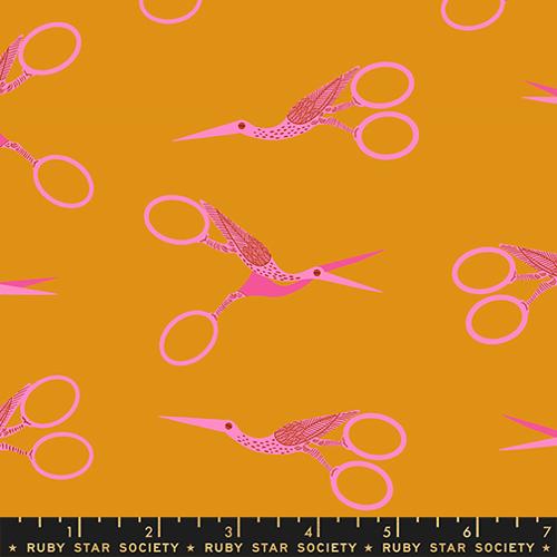 Pattern of pink scissors on a mustard yellow background with Ruby Star Society label.