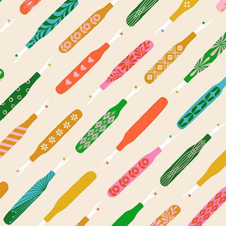 Pattern of colorful seam rippers on a beige background 