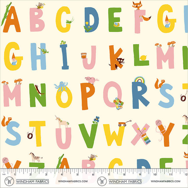 Alphabet fabric pattern featuring colorful uppercase letters with whimsical animal and object illustrations on a cream background, with a ruler at the bottom showing scale. Brand text 'WINDHAM FABRICS' is visible along the bottom edge.