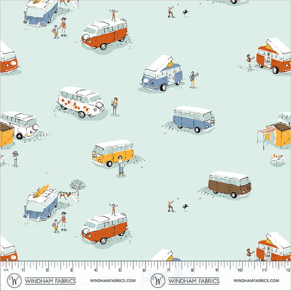 A repeating illustrated pattern of retro campervans, beach umbrellas, people, and small beach elements on a pale mint background, with a Windham Fabrics ruler and brand text along the bottom edge.