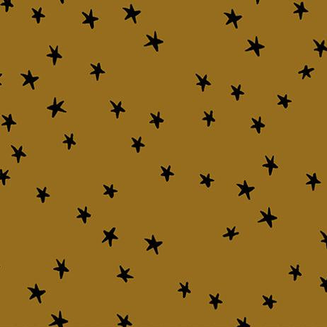 Fabric with black star pattern on a mustard yellow background,
