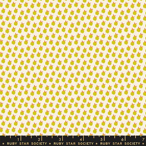 Pattern of green apples with red stems on a beige background, featuring Ruby Star Society label.