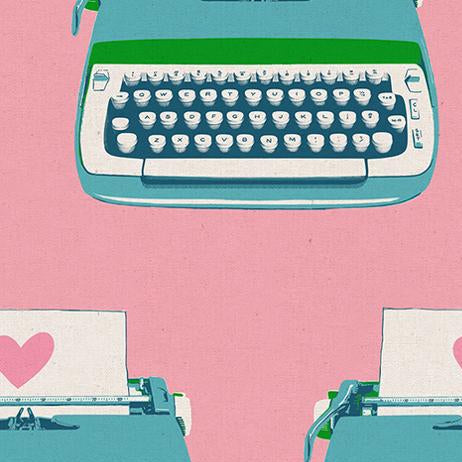 Teal typewriter on a pink background w