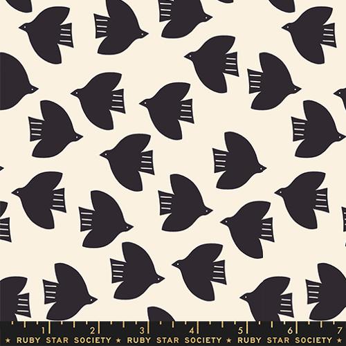Pattern of black birds on a beige background with Ruby Star Society label.