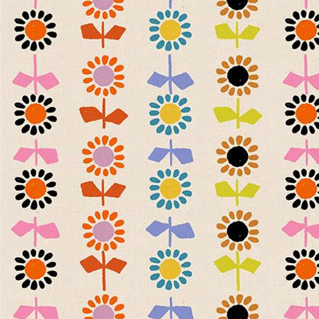 Patterned fabric with colorful flowers and bows on a beige background