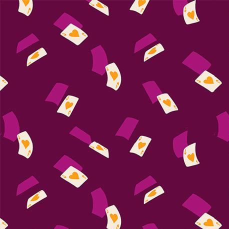 Patterned fabric with geometric shapes on a purple background,