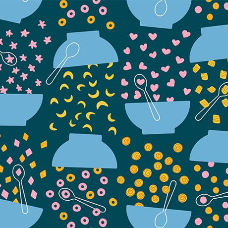 Patterned fabric with blue bowls, spoons, and colorful shapes on a dark blue background.