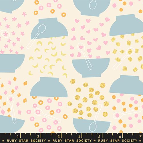 Fabric pattern with blue bowls, pink hearts, and yellow shapes on a beige background, featuring Ruby Star Society label.