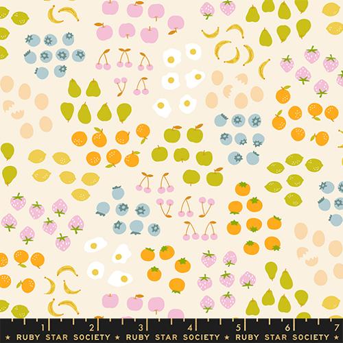 Patterned fabric with fruits and vegetables on a beige background, featuring Ruby Star Society label.