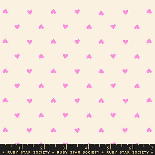 Pattern of small pink hearts on a beige background with Ruby Star Society label at the bottom.