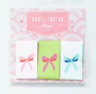 Set of labels with colorful bows on a white background
