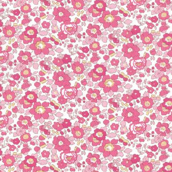 A repeating floral pattern featuring pink and magenta flowers with yellow centers on a white background.