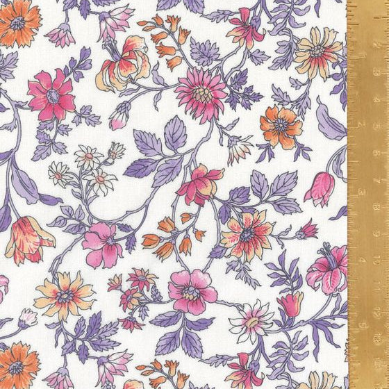 Floral patterned fabric with a ruler for scale on a white background