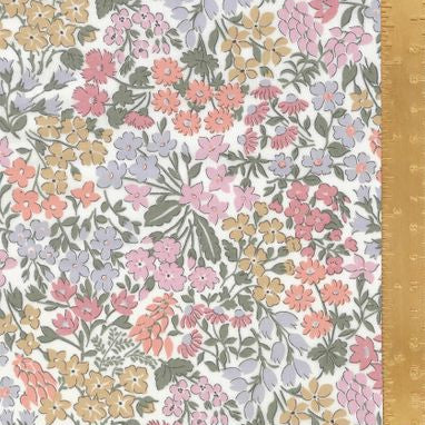 Floral patterned fabric with a ruler for scale on a white background