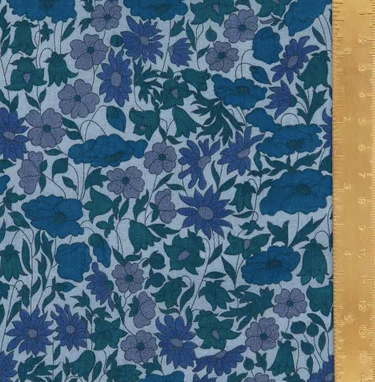 Blue floral patterned fabric with a wooden ruler for scale.