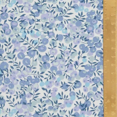 Floral patterned fabric with a ruler for scale on the right side