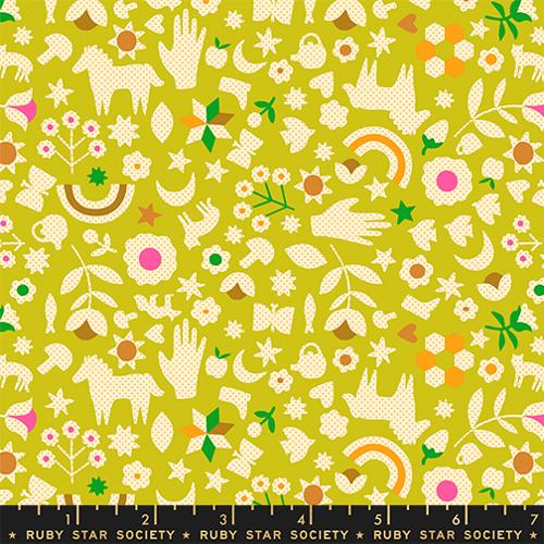 Patterned fabric with various shapes and colors on a green background, featuring the Ruby Star Society label.