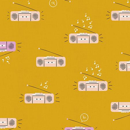 Pattern of vintage radios and music notes on a mustard yellow background 