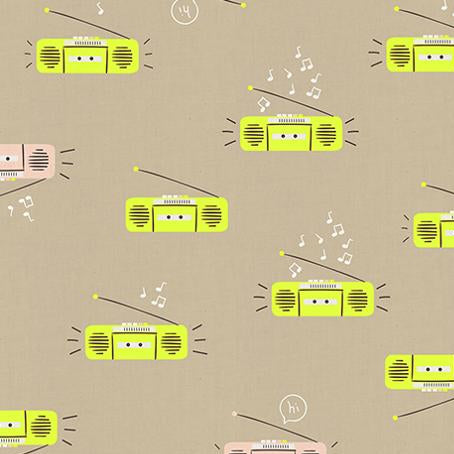 Fabric with retro radio pattern on a beige background