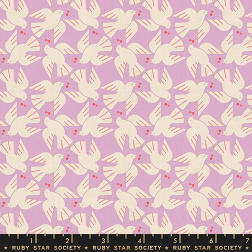 A repeating fabric pattern featuring cream-colored doves with small red berries on a light lavender background, with a black Ruby Star Society ruler along the bottom edge showing scale.