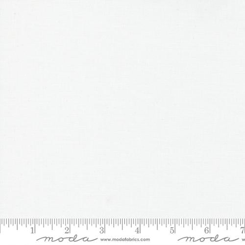 White fabric swatch with Moda label and ruler at the bottom