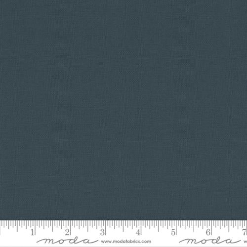 Solid black fabric swatch with a ruler at the bottom