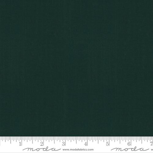 Solid dark green fabric swatch with a ruler at the bottom