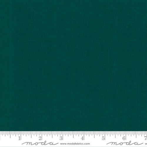 Solid teal fabric swatch with a ruler at the bottom