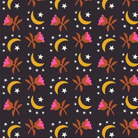 Patterned fabric with moons, stars, and flowers on a dark background