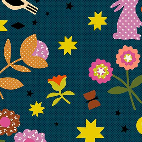 Colorful fabric pattern with flowers, stars, and other shapes on a blue background.
