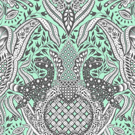 Patterned fabric with black and white designs on a green background
