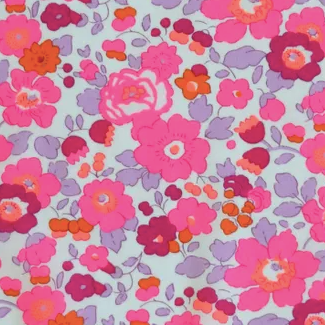 Floral pattern fabric with pink and orange flowers on a light blue background