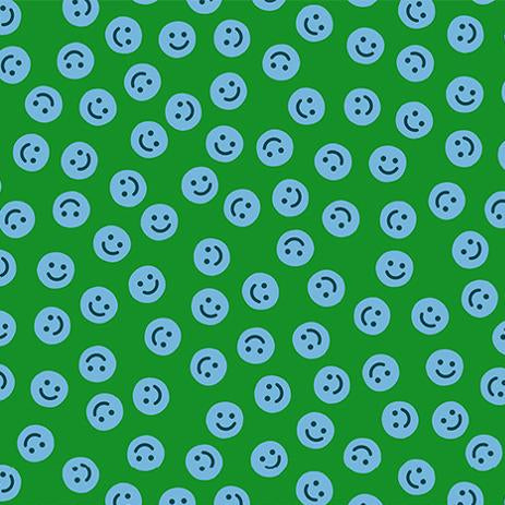Pattern of blue smiley faces on a green background\