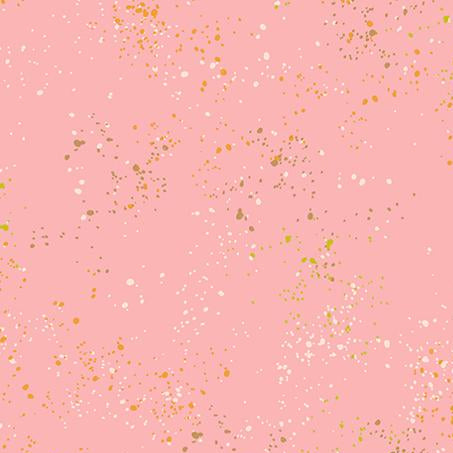 Pink fabric with gold and white confetti pattern,