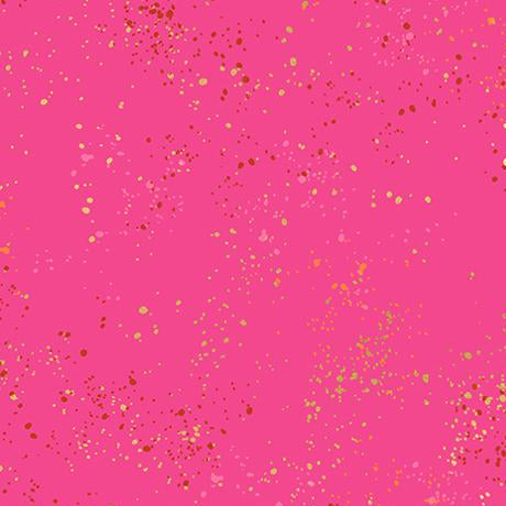 Pink fabric with gold glitter dots and a ruler at the bottom