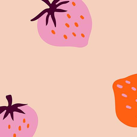 Fabric with pink and orange strawberries on a peach background