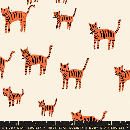 Pattern of orange and black striped cats on a beige background with a ruler at the bottom.