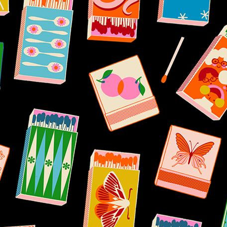 Colorful matchboxes with various designs on a black background