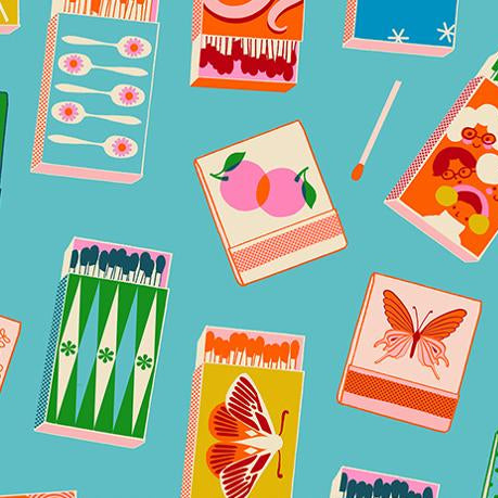 Patterned fabric with colorful matchbox designs on a blue background,
