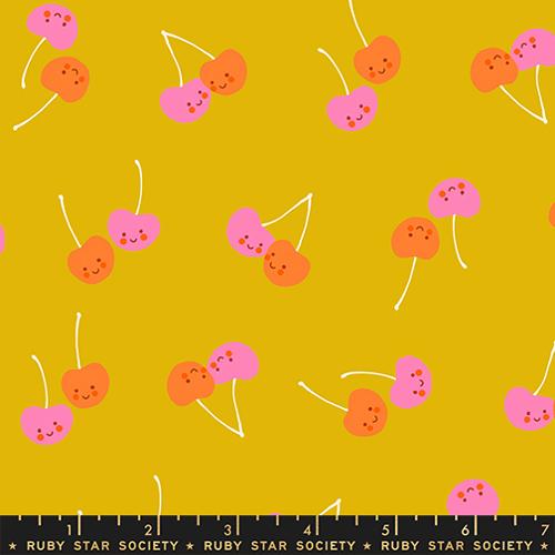 Pattern of cartoon cherries on a yellow background with a ruler at the bottom.