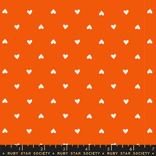 White hearts pattern on an orange background with Ruby Star Society label.