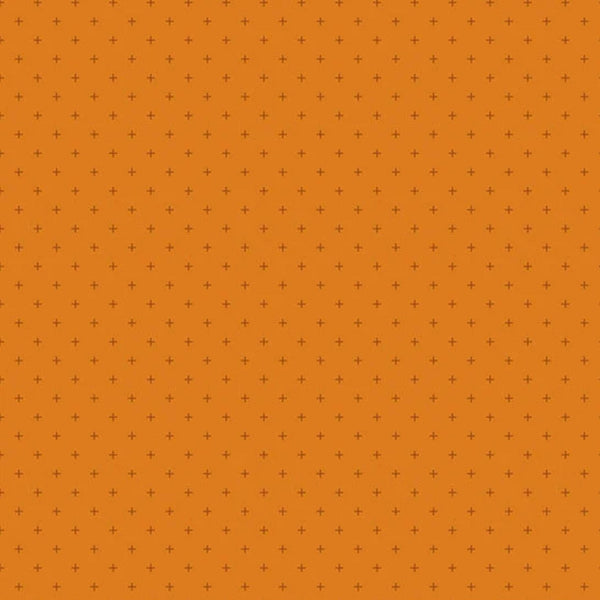 A close-up of a repeating pattern featuring small dark brown plus signs arranged in a grid over a solid orange background.